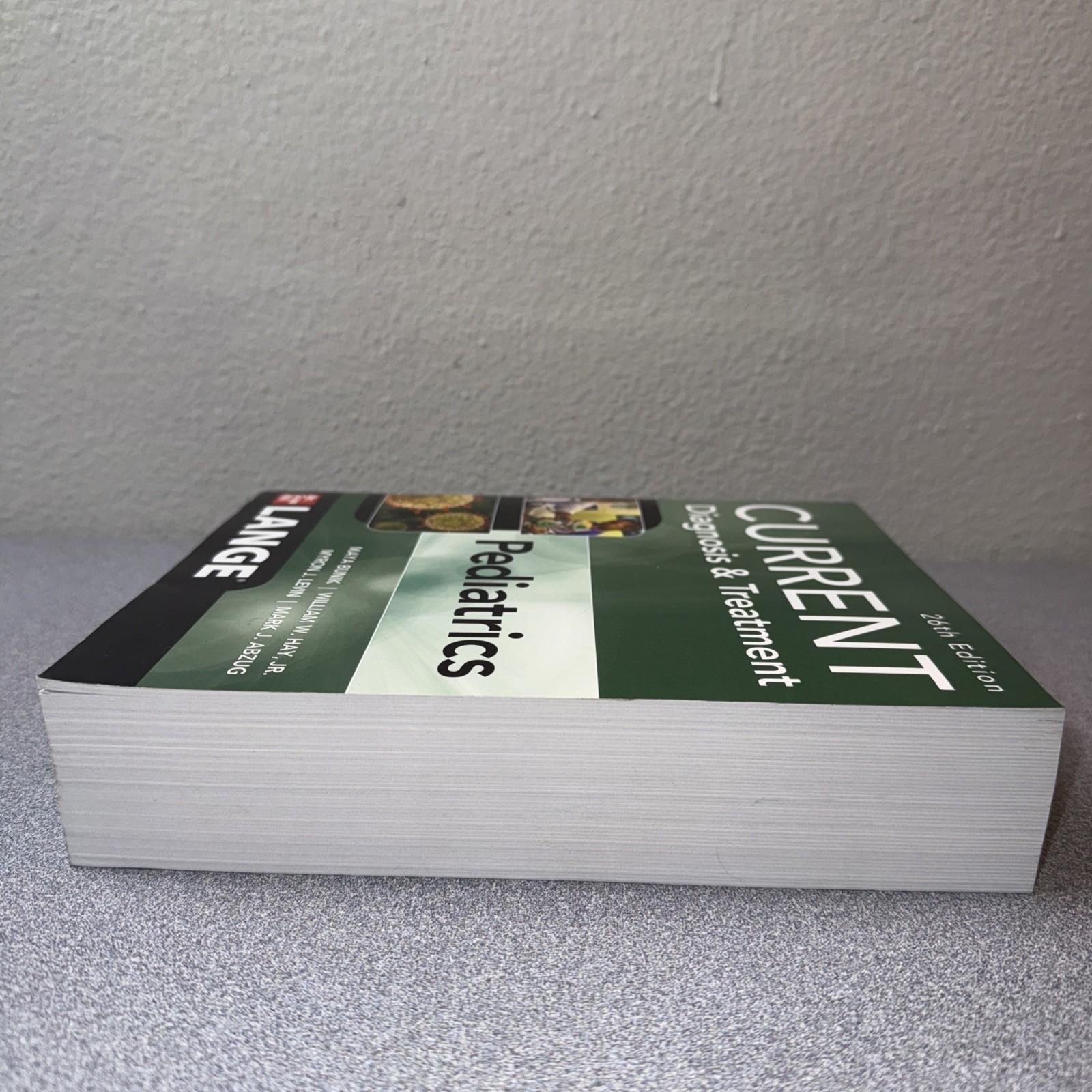 Current Diagnosis & Treatment Pediatrics, 26th Edition Paperback Good